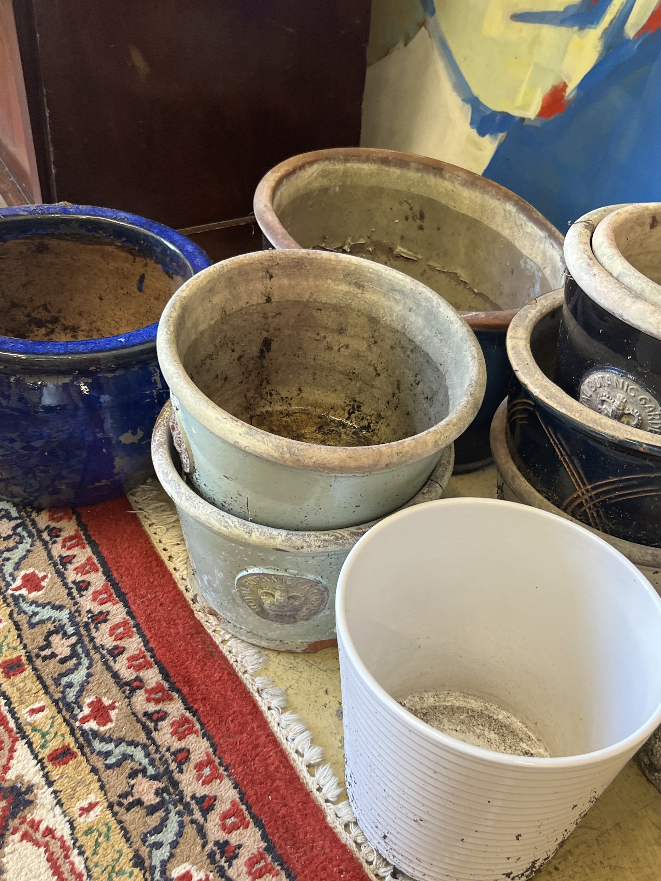 Ten assorted planters and a reconstituted stone owl garden ornament, largest width 38cm